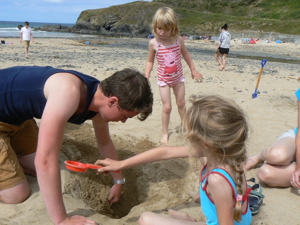 Philip digging a hole with Abi